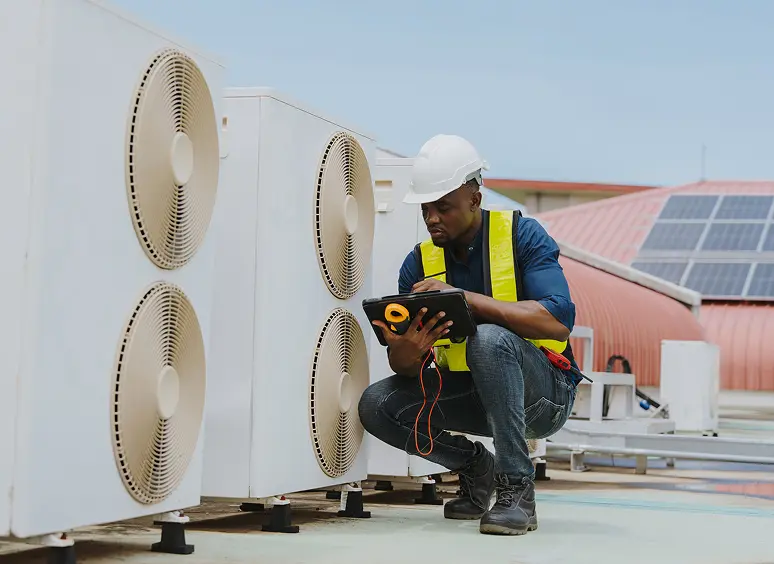 Engineer checking HVAC systems on roof